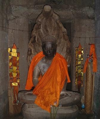 A well-dressed figure, inside one of Angkor Thom's many rooms/enclosures