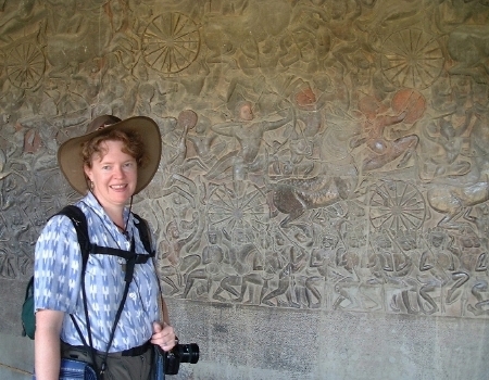 Karen, in front of the western wall, with just a tiny portion of all the bas-relief carvings in view