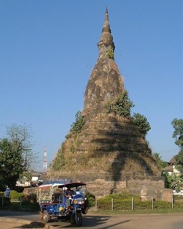 That Dam, a/k/a the Black Stupa (with palm tree shadow at base), near central Vientiane