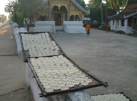 Rice cakes, drying outside a wat, late afternoon
