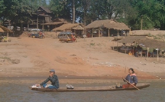 Lao man and woman in a small boat