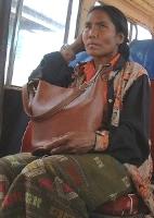 Another woman on a Lao bus, another surreptitiously-taken photo with our digital camera... great skirt!