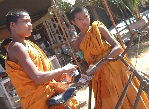 Two young monks and a bicycle (Sarawan, Laos)