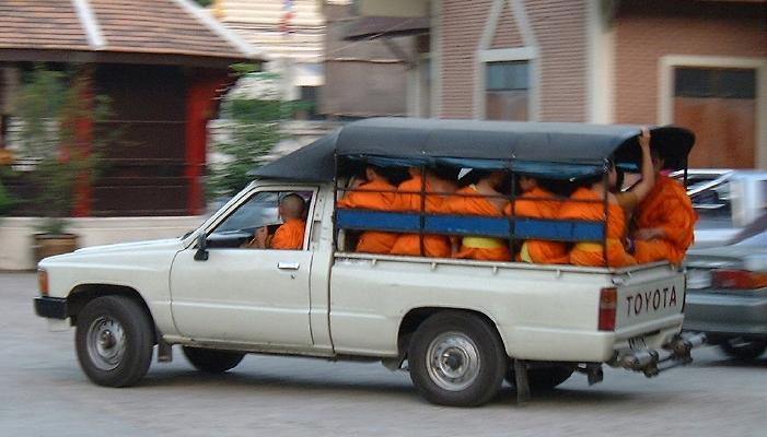Truckload of monks, on their way home at sunset (Chiang Mai)
